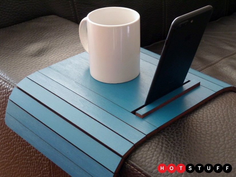 ATOS is a designer arm-rest table for your smartphone and coffee mug