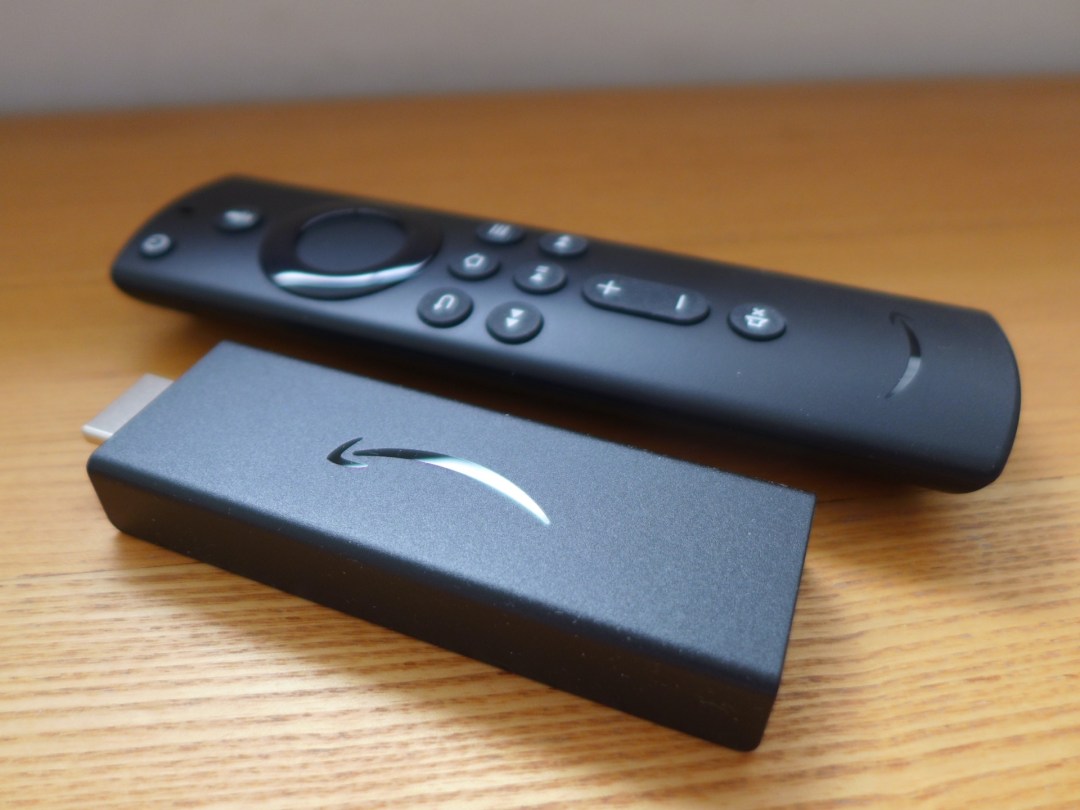 Amazon's Fire TV Stick pictured alongside a remote