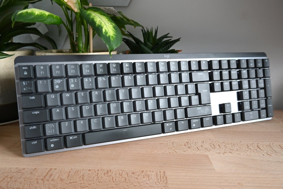 Stuff review Logitech MX Mechanical three-quarters angle next to plants