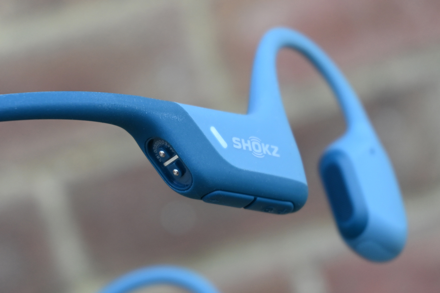 Shokz Openrun Pro headphones charging port