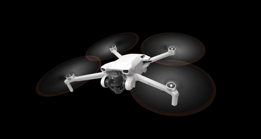 DJI's new Mini 3 drone against a black background