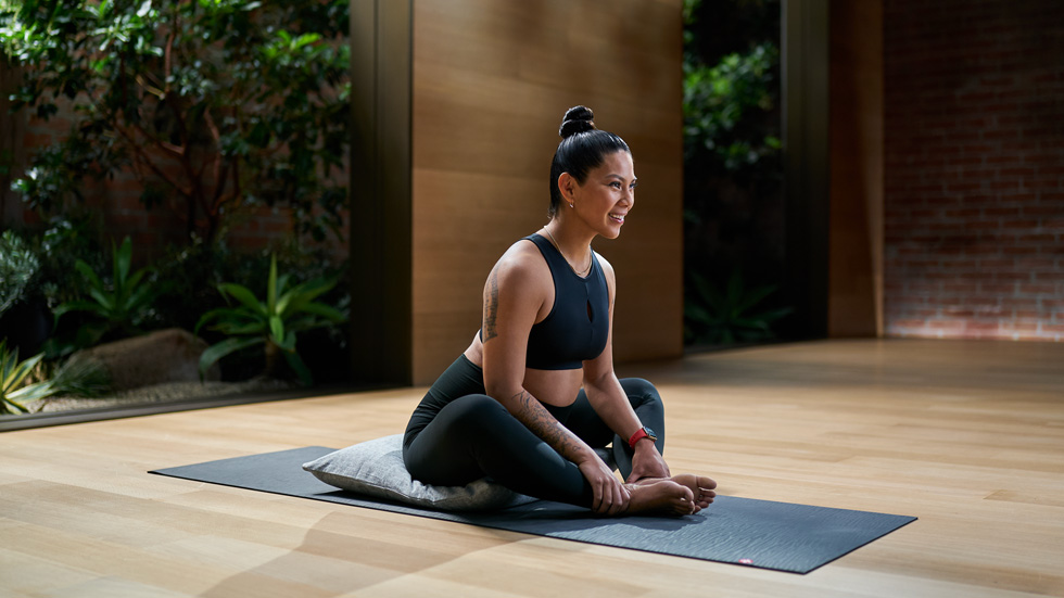 Apple Fitness+ trainer leading a meditation class