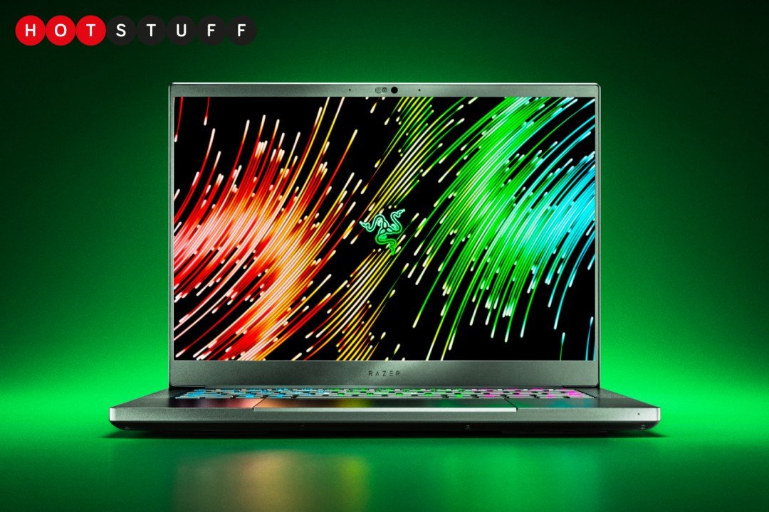 Razer Blade 14 laptop on a green background