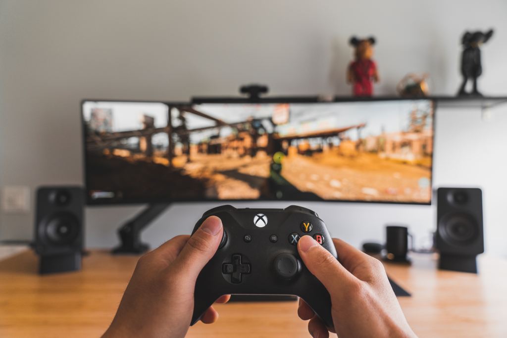 Gaming with an Xbox controller. Credit: Sam Pak on Unsplash